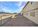 The rear exterior view of a multi-Gathering home with gravel landscaping at 4368 Vornsand Dr, Las Vegas, NV 89115