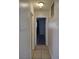 Hallway with tile flooring and a view of the bedroom through an open doorway at 4368 Vornsand Dr, Las Vegas, NV 89115