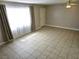 Open-concept living room with ceiling fan and tile flooring at 4368 Vornsand Dr, Las Vegas, NV 89115