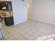 Open concept living room and kitchen area with tile flooring, range and plenty of space at 4368 Vornsand Dr, Las Vegas, NV 89115