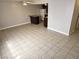 Open-concept living room with ceiling fan and tile flooring at 4368 Vornsand Dr, Las Vegas, NV 89115