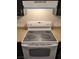 This kitchen features a white oven and stove top with a light colored countertop at 4368 Vornsand Dr, Las Vegas, NV 89115