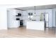 Bright, modern kitchen with white cabinetry, stainless steel appliances, and a center island at 4818 E Monroe Ave, Las Vegas, NV 89110