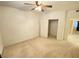 Cozy bedroom featuring neutral carpet, a ceiling fan, and a closet at 5751 E Hacienda Ave # 130, Las Vegas, NV 89122