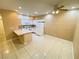 Bright kitchen featuring tile floors, stainless appliances, and an island at 5751 E Hacienda Ave # 130, Las Vegas, NV 89122
