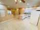 Open kitchen with island, white cabinetry, and tile flooring at 5751 E Hacienda Ave # 130, Las Vegas, NV 89122