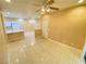 Inviting living room featuring tile floors, neutral paint, and open layout at 5751 E Hacienda Ave # 130, Las Vegas, NV 89122