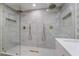 Modern bathroom featuring dual rainfall shower heads, gold accents, and sleek design at 616 Lacy Ln, Las Vegas, NV 89107