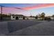 Exterior shot showcasing a large lot with various buildings and backyard amenities at 616 Lacy Ln, Las Vegas, NV 89107