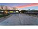 Spacious driveway and well-maintained landscaping enhance the curb appeal of this charming home at 616 Lacy Ln, Las Vegas, NV 89107