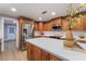 Bright kitchen featuring stainless steel appliances, white countertops, wood cabinets and modern fixtures at 616 Lacy Ln, Las Vegas, NV 89107