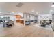 Bright, open-concept living room featuring a fireplace, light wood floors, and modern decor at 616 Lacy Ln, Las Vegas, NV 89107