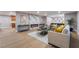 Spacious living room with stylish decor, a sleek fireplace, comfortable seating, and ample natural light at 616 Lacy Ln, Las Vegas, NV 89107
