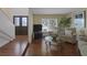 Inviting living room featuring wood floors, neutral paint, a large window, and comfortable seating for Gathering and guests at 645 Paloma Dr, Boulder City, NV 89005