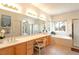 Bright bathroom featuring double vanity, a soaking tub, and a shower at 6557 Secluded Ave, Las Vegas, NV 89110