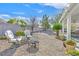 Landscaped backyard featuring a cozy fire pit area and comfortable seating, great for gatherings at 6710 Pyracantha Glen Ct, Las Vegas, NV 89131