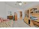 Bright bedroom with built-in desk and shelving, ideal for an office space at 6710 Pyracantha Glen Ct, Las Vegas, NV 89131