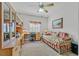 Cozy bedroom with daybed, desk, and built-in shelving, perfect for a home office or guest room at 6710 Pyracantha Glen Ct, Las Vegas, NV 89131