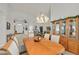 Bright and airy dining area with a chandelier and views into living spaces at 6710 Pyracantha Glen Ct, Las Vegas, NV 89131