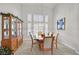 Dining area features bright light from adjacent windows and traditional furnishings at 6710 Pyracantha Glen Ct, Las Vegas, NV 89131