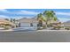 Charming home with a three-car garage, desert landscaping, and a welcoming entrance at 6710 Pyracantha Glen Ct, Las Vegas, NV 89131