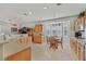 Bright kitchen with tile floors, breakfast nook and views into the adjacent living area at 6710 Pyracantha Glen Ct, Las Vegas, NV 89131