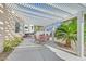 Charming patio with a pergola, outdoor seating, and view of the landscaped backyard at 6710 Pyracantha Glen Ct, Las Vegas, NV 89131