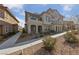 Attractive exterior view of home featuring manicured landscaping and community sidewalks at 73 Lomita Heights Dr, Las Vegas, NV 89138