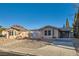 A cozy single-story home boasting desert landscaping, a carport, and a gated entrance at 798 Shirley Ln, Boulder City, NV 89005