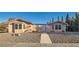 Inviting single-story home with a decorative gate, desert landscaping, and a charming facade at 798 Shirley Ln, Boulder City, NV 89005