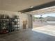 Attached garage with shelving, ample storage, and views of the front exterior at 798 Shirley Ln, Boulder City, NV 89005