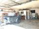 A large garage features ample room for storage and projects with good lighting at 798 Shirley Ln, Boulder City, NV 89005
