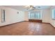 Spacious living room with tile floors, plantation shutters, and custom built-ins at 798 Shirley Ln, Boulder City, NV 89005