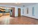 Spacious room featuring a large window and access to the kitchen with wood cabinetry at 798 Shirley Ln, Boulder City, NV 89005