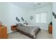 Bedroom showcasing a comfortable bed with stylish decor, accented by neutral wall art and a large window at 814 Lake Hill Dr, Boulder City, NV 89005