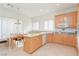 Bright kitchen featuring wood cabinets and an island at 814 Lake Hill Dr, Boulder City, NV 89005