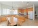 Eat-in kitchen with wood cabinets and a large center island with tile flooring at 814 Lake Hill Dr, Boulder City, NV 89005