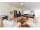 Bright living room with a fireplace, neutral carpet, and lots of seating at 814 Lake Hill Dr, Boulder City, NV 89005