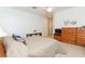 Comfortable bedroom with a ceiling fan, neutral decor, and natural light at 814 Lake Hill Dr, Boulder City, NV 89005
