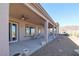 Covered patio with multiple ceiling fans overlooking the landscape at 814 Lake Hill Dr, Boulder City, NV 89005