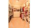 Spacious walk-in closet featuring custom shelving, hanging rods, and ample storage space for clothes and accessories at 814 Lake Hill Dr, Boulder City, NV 89005