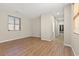 Spacious living room with wood-look flooring and bright natural light at 8140 Redbud Vine St, North Las Vegas, NV 89085