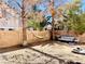 Spacious backyard with a hammock, privacy fence and mature trees at 8209 Violet Meadow Ct, Las Vegas, NV 89117