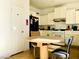 Functional kitchen featuring white cabinets, and access to the front door at 8209 Violet Meadow Ct, Las Vegas, NV 89117