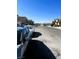 Residential street view with parked cars and clear sky at 8209 Violet Meadow Ct, Las Vegas, NV 89117