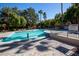 Community pool with surrounding trees and lounge chairs at 9000 Las Vegas Blvd # 2048, Las Vegas, NV 89123