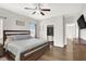 Comfortable primary bedroom features a ceiling fan, carpeted floors, and bright natural light at 9138 Sea Mink Ave, Las Vegas, NV 89149