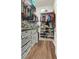 Organized walk-in closet with shelving and storage, providing ample space for clothes and accessories at 9138 Sea Mink Ave, Las Vegas, NV 89149