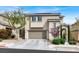 Charming two-story home with a well-manicured lawn and an attached two-car garage at 9138 Sea Mink Ave, Las Vegas, NV 89149