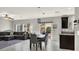 Open-concept living and dining area with tile floors, modern furnishings, and ample natural light at 9138 Sea Mink Ave, Las Vegas, NV 89149